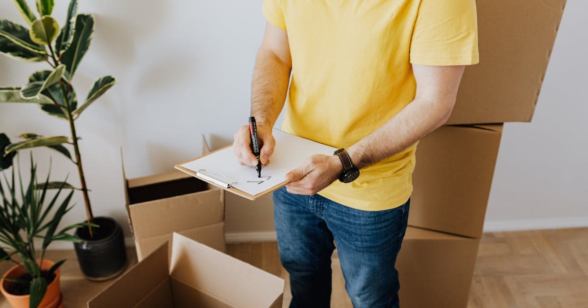 Home inspector examining house systems with clipboard and checklist