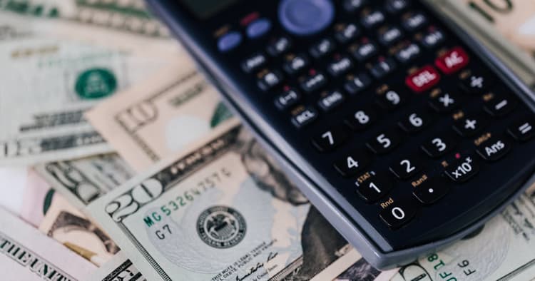 Home buyer reviewing earnest money contract documents at closing table